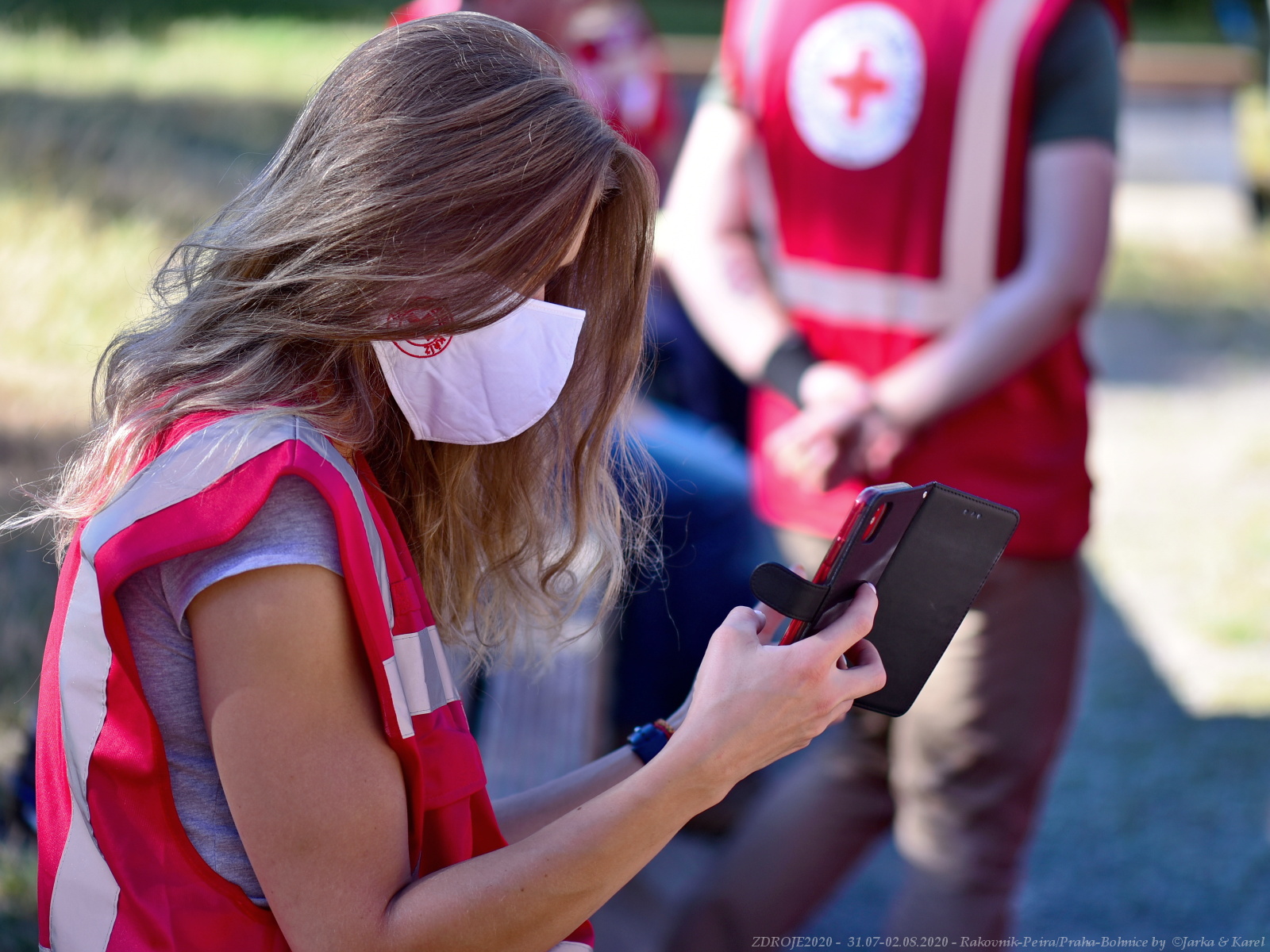 A Red Cross volunteer uses the GINA GO app